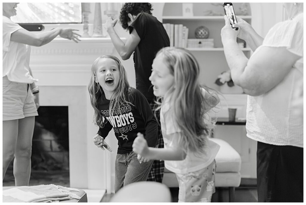 Lifestyle family photos in Virginia - cousins dancing on the farm in Blackstone